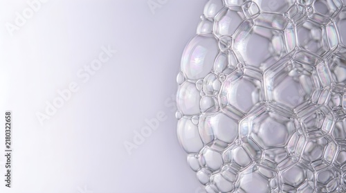 transparent soap bubbles floating together in a natural cluster concentrated along one side of the frame with the opposite side intentionally uncluttered and open for copy space
