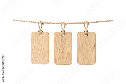 Three blank wooden hanging tags on jute rope for product pricing and rustic branding display.