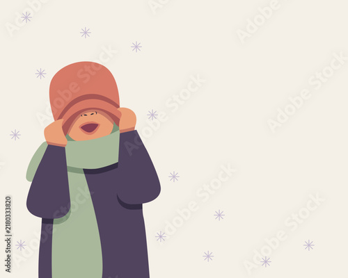 playful person hiding eyes under an oversized winter hat