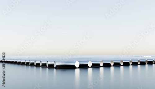 Chrome metal tubes horizontally arranged on reflective surface