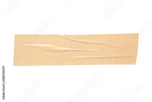 Obraz na płótnie Packaging and repair concept, single strip of beige adhesive tape with wrinkles