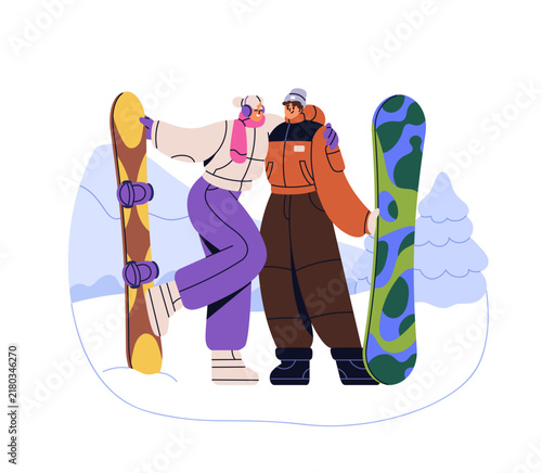 Love couple at mountain resort, standing with snowboards, hugging. Happy man ...