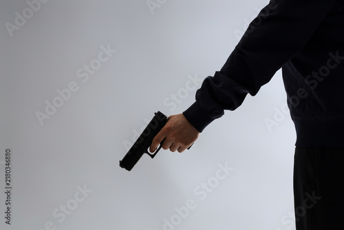 Canvas Print Man with gun on grey background