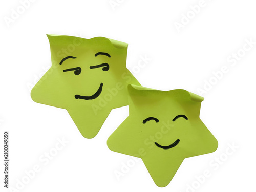 Obraz na plátne Two light green sticky notes shaped like stars with happy and winking faces draw