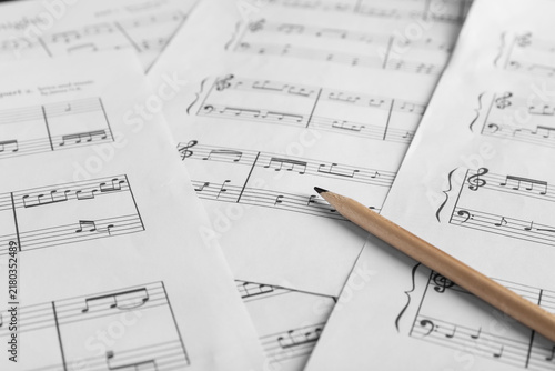 Obraz na płótnie Paper sheets with notes and pencil as background