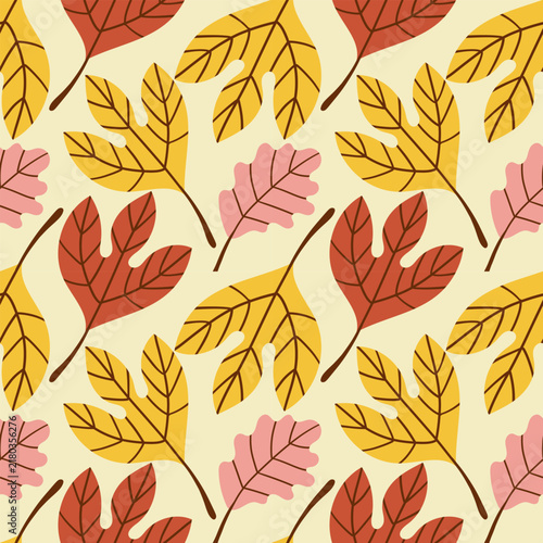 Colorful autumn leaves scattered on colorful background create a vibrant seasonal pattern. Seamless pattern ,hand drawn illustration ,cozy autumn pattern for social media ,wrapping paper and fabric .