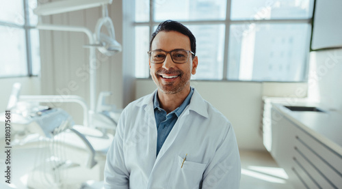 Orthodontics specialist dentist smiling in a clean modern clinic