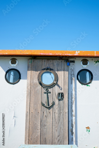Close-up of the entrance door to a small fishing boat.
