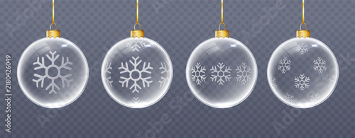 Glossy glass baubles hanging on decorative ribbons, combining transparent spherical forms, snowy details, and charming Christmas holiday aesthetics.