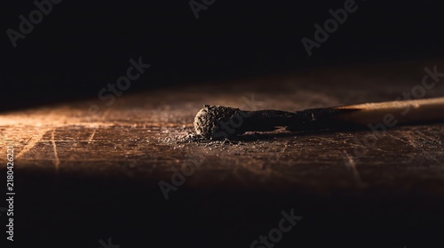 Burned out matchstick symbolizing emotional exhaustion and depleted energy