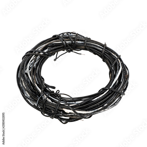Картината върху платно Coiled bundle of black metal wire tied in several places, isolated on a transparent background for industrial, construction, repair, and recycling concepts