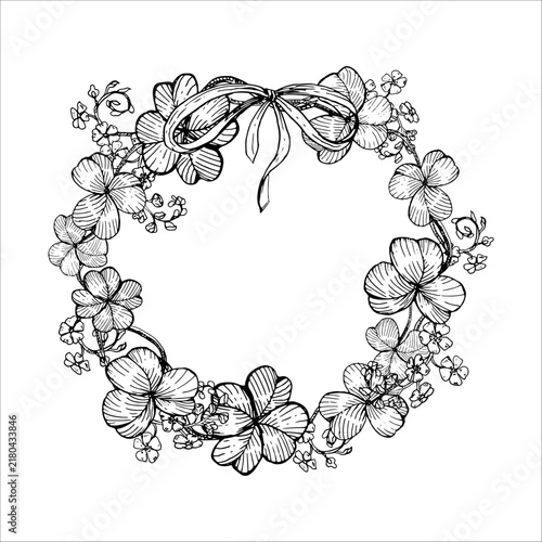 Clover and forget-me-not wreath with a bow hand drawn vector ink sketch. Monochrome line art botanical circular frame for St Patricks day greeting cards, Irish branding, tattoo, and festive print.