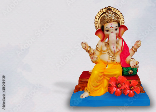 фотографія Beautiful colorful Lord Ganesha idol poster  with background