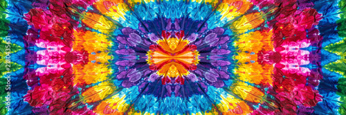 Canvastavla Vibrant tie dye fabric pattern featuring kaleidoscopic shapes and vivid rainbow
