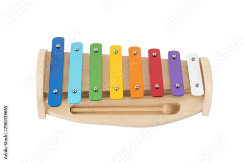 Fotografie Colorful wooden toy xylophone with eight rainbow-colored metal bars and a mallet