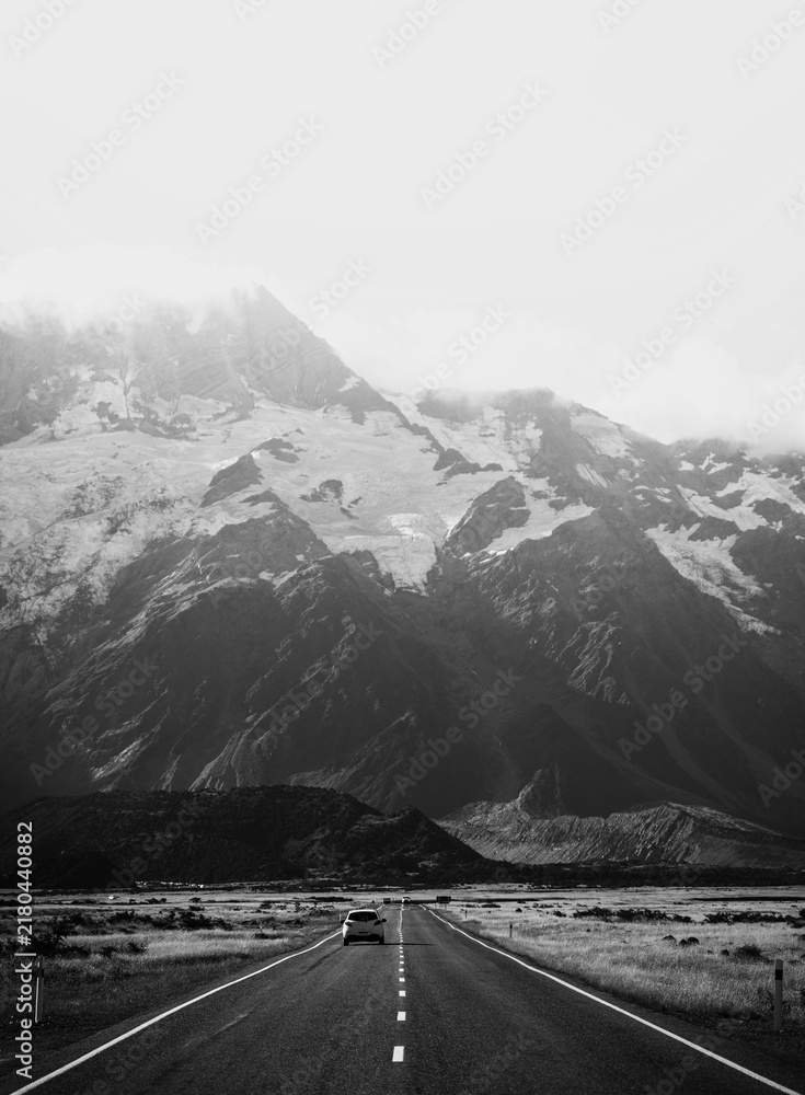 Obraz premium Beautiful view of a road leading to Mount Cook, New Zealand in grayscale