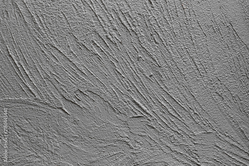 A beautiful abstract grunge-style plastered wall background featuring decorative patterns; an artistic banner image with a rough texture and space for text.