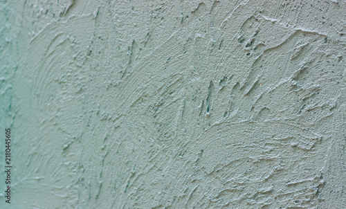 A beautiful abstract grunge-style plastered wall background featuring decorative patterns; an artistic banner image with a rough texture and space for text.