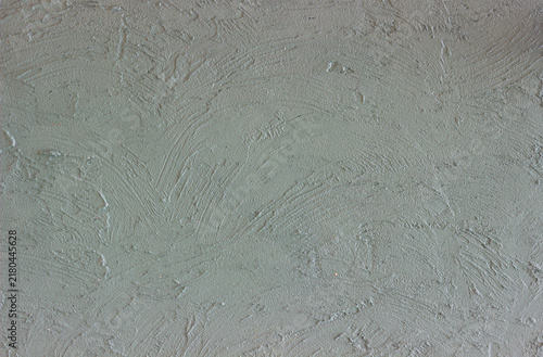 A beautiful abstract grunge-style plastered wall background featuring decorative patterns; an artistic banner image with a rough texture and space for text.