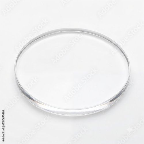 Generic precision optical flat quartz glass lens disc for flatness testing isolated on white.