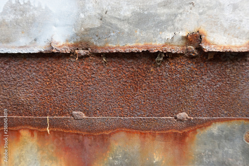Картината върху платно Rust covers metal surfaces in vivid orange tones