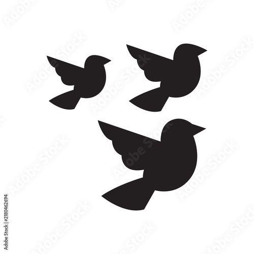 Flock of three flying birds silhouette