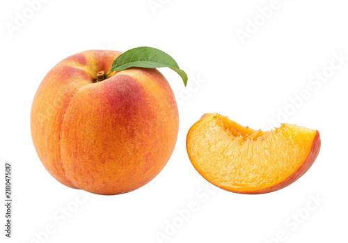 Juicy ripe peach with a slice showing its vibrant orange flesh and green leaf