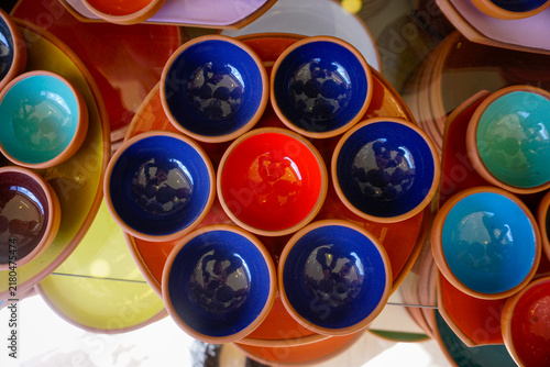 Obraz na płótnie Colorful glazed terracotta ceramic bowls stacked on display