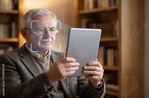 Senior man using accessible biometric authentication