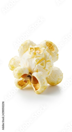 Freshly popped popcorn kernels in a white pile.