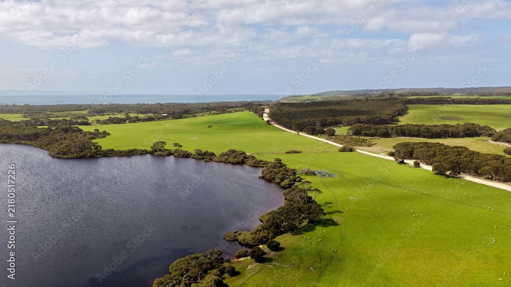 Obraz premium Antechamber Bay, Kangaroo Island, South Australia – 4K Aerial Drone View of Lashmar Lagoon, Green Farmland, Sheep Farms, Country Roads and Rural Coastal Landscape