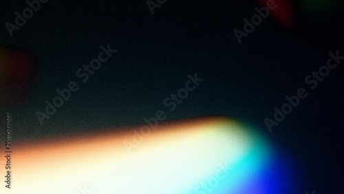 Grainy Prism Light Leak Background with Warm Flare and Subtle Film Noise Texture