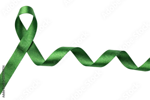 Green satin awareness ribbon looped with a long wavy tail extending to the right side isolated on a transparent background