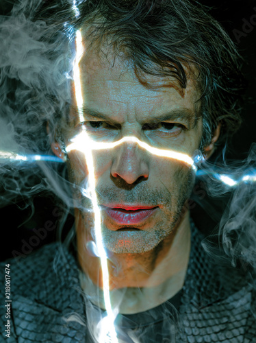 Man with Cross‑Shaped Light and Smoke