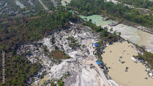 Konstfotografi Open pit mining site causing land degradation and water pollution in South Kalim