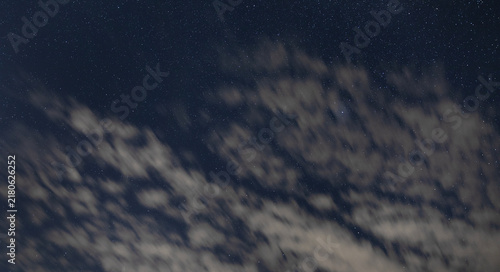 Thin clouds blowing in the night