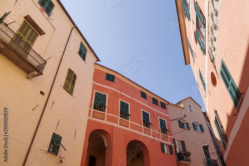 Colorful facades of houses in the historic center of Imperia, Liguria region, Italy