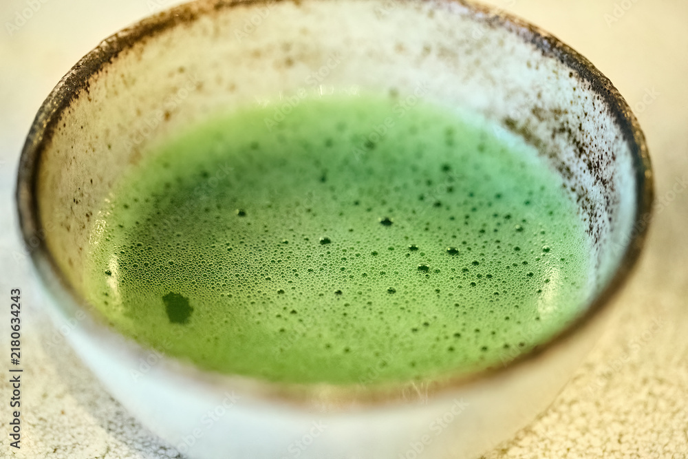 Obraz premium Matcha green tea bowl with ceremonial foam
