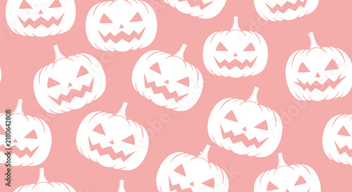 Seamless pattern of white jack o lantern faces on pink background halloween decoration concept graphic illustration.
