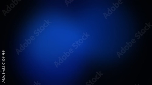 An abstract dark blue background with soft light gradients and deep shadows