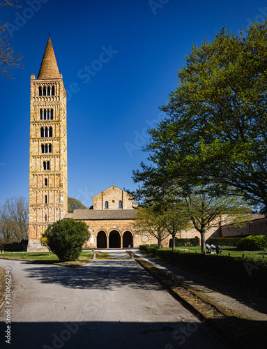 Konstfotografi Pomposa Abbey campanile reaching blue sky in Emilia-Romagna, Italy