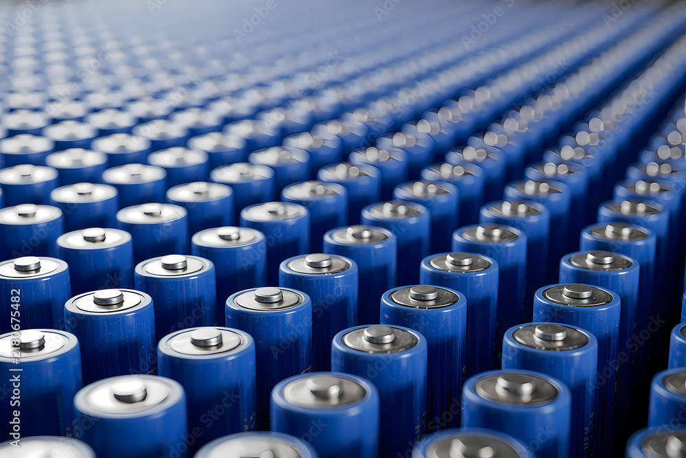 Fototapeta premium Rows of blue batteries arranged in a uniform pattern.