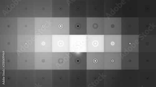 Abstract monochrome grid pattern with varying circular gradient highlights