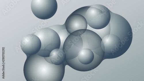 Abstract composition of translucent overlapping spheres on a grey background