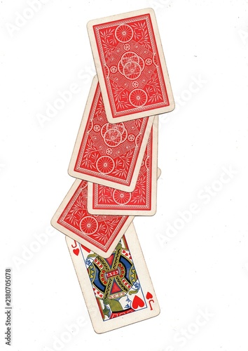 A hand of vintage playing cards isolated on a white background.