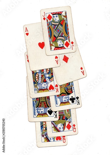 A hand of vintage playing cards isolated on a white background.