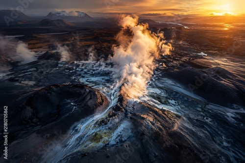 Volcanic steam erupting during sunrise with dramatic geothermal landscape and orange sky
