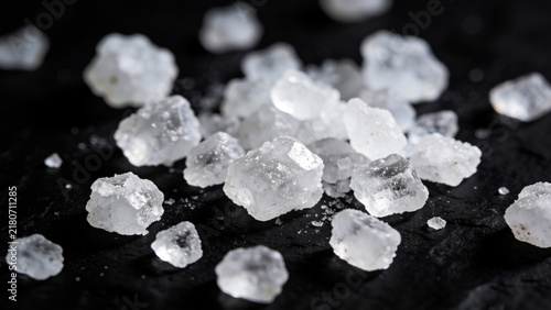 Coarse sea salt crystals background, natural white mineral seasoning ingredient