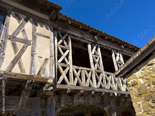Close-up of a half-timbered house upper floor with crisscrossing wooden beams, Gers, Bassoues, France