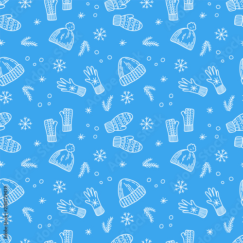 Seamless pattern with hand drawn winter elements, knitted hats, mittens, snowflakes, and pine branches